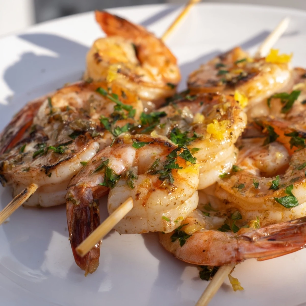 Grilled Lemon Garlic Shrimp Skewers with charred edges and fresh parsley garnish on a rustic wooden platter.  