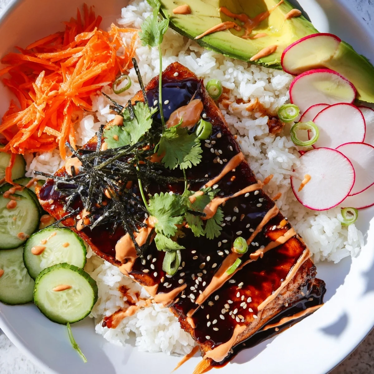 Tender teriyaki-glazed salmon rests on fluffy jasmine rice, topped with quick-pickled veggies and drizzled with spicy sriracha mayo in these Teriyaki Salmon Rice Taco Bowls with Pickled Veggies.