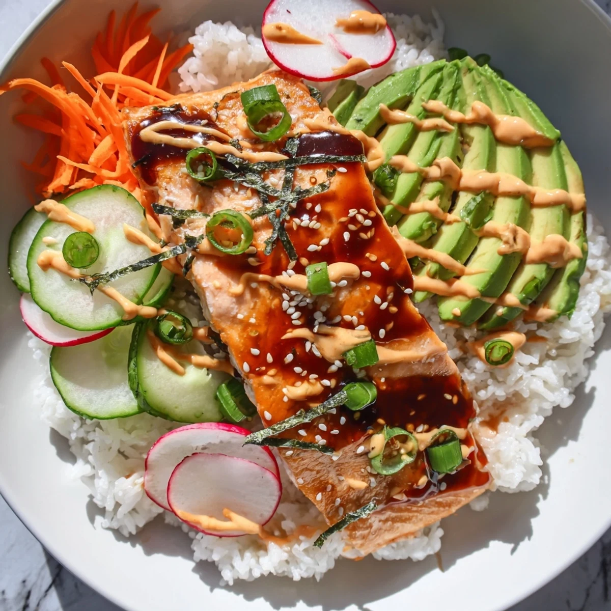 Bright, crunchy pickled carrots and cucumbers add fresh contrast to the savory salmon and warm rice in these vibrant Teriyaki Salmon Rice Taco Bowls with Pickled Veggies.