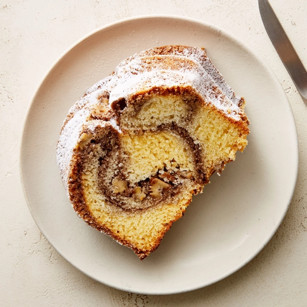 Easy breakfast Bundt coffee cake with marbled cinnamon sugar and nut topping