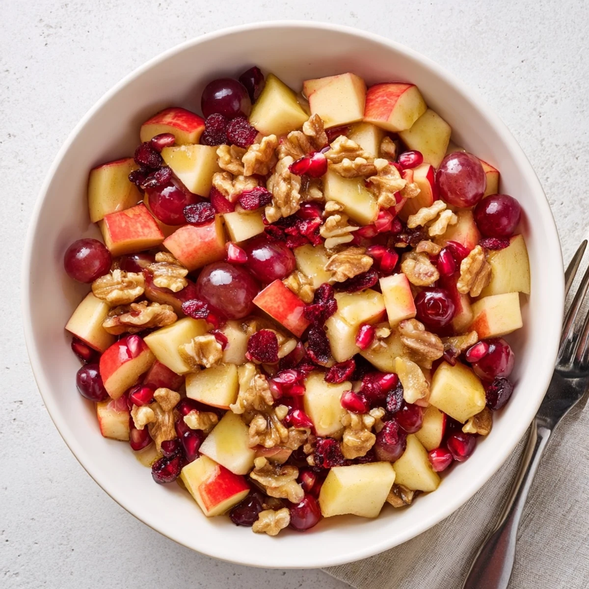 Easy Minute Fall Fruit Salad with diced apple pear grapes and cinnamon orange dressing