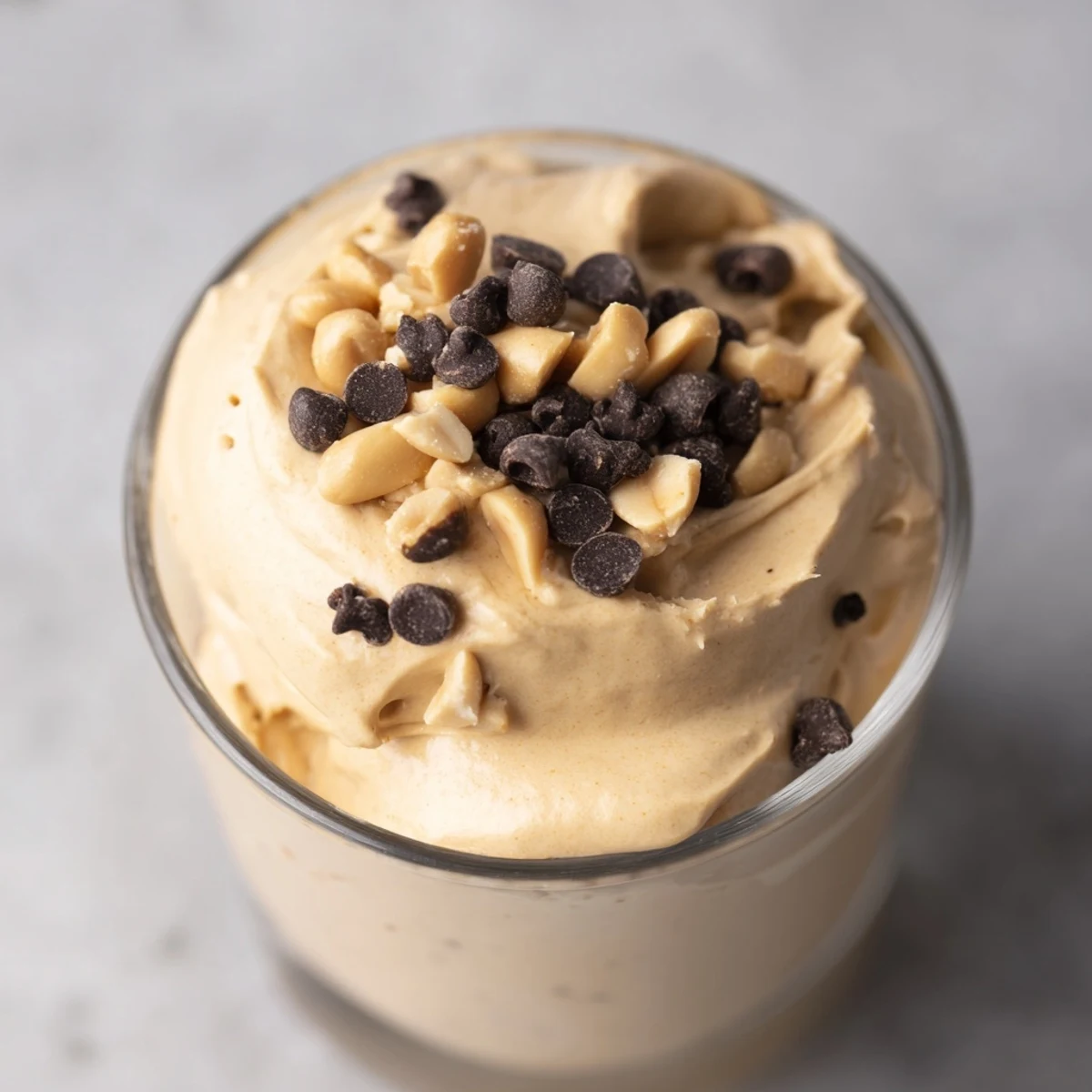 Fluffy Peanut Butter and Cool Whip Mousse served chilled in individual dessert cups with garnish