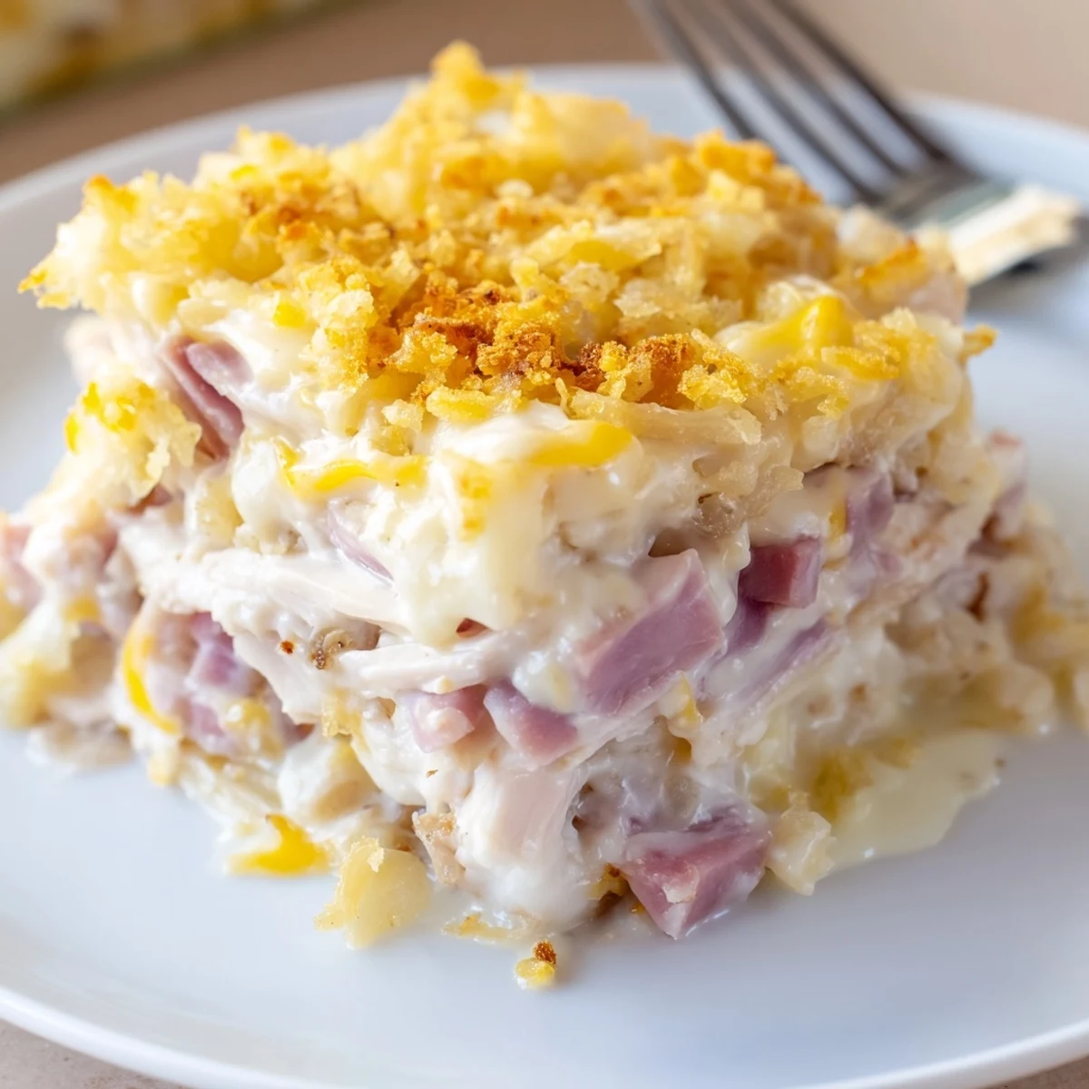 Warm Chicken Cordon Bleu Casserole Recipe layered with ham and melted Swiss cheese