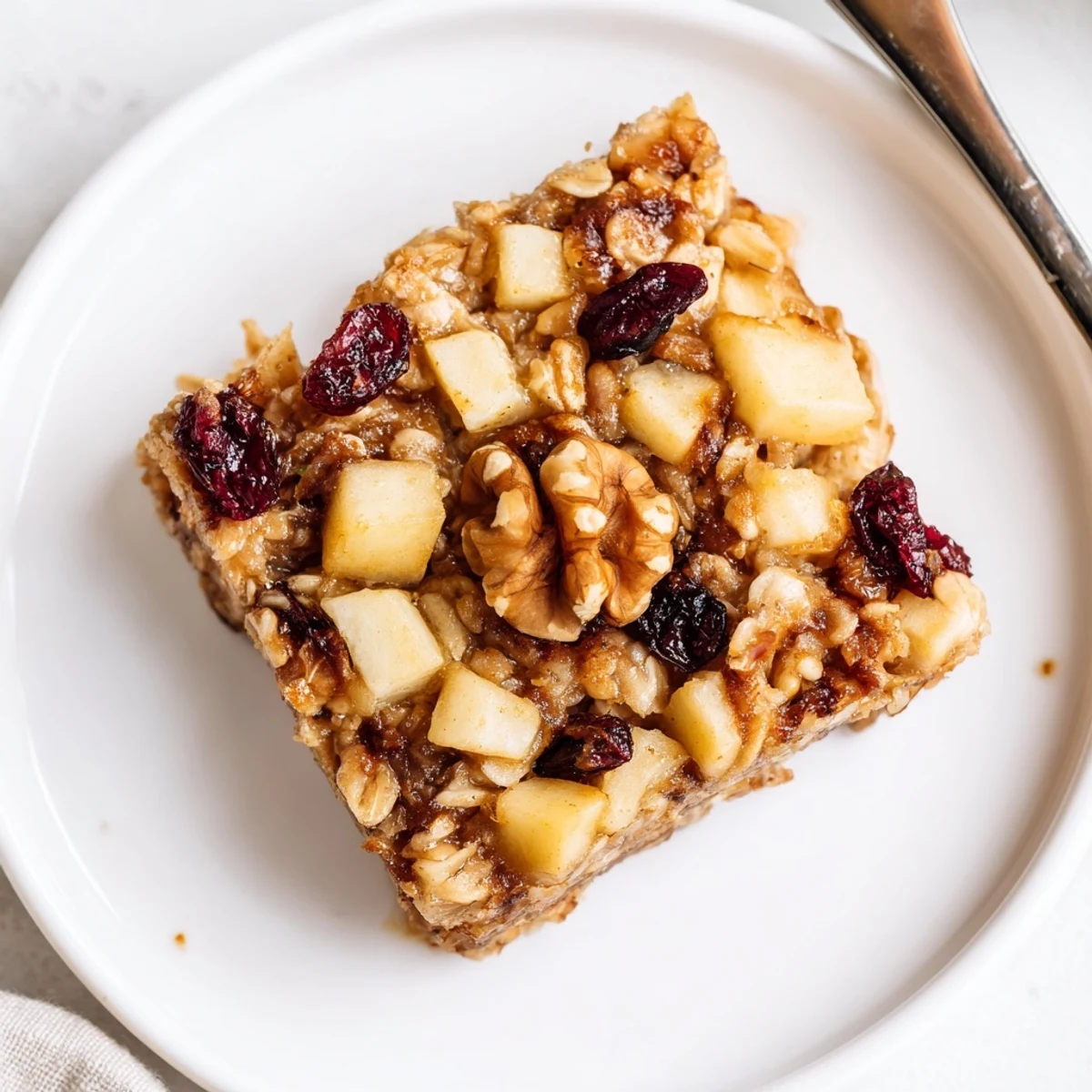 Warm Delicious Apple Cinnamon Oatmeal Bake Recipe For Mornings topped with yogurt