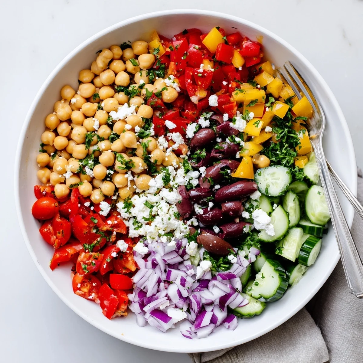 Generous spoonfuls of Vibrant Mediterranean Chickpea Delight with crisp cucumber  