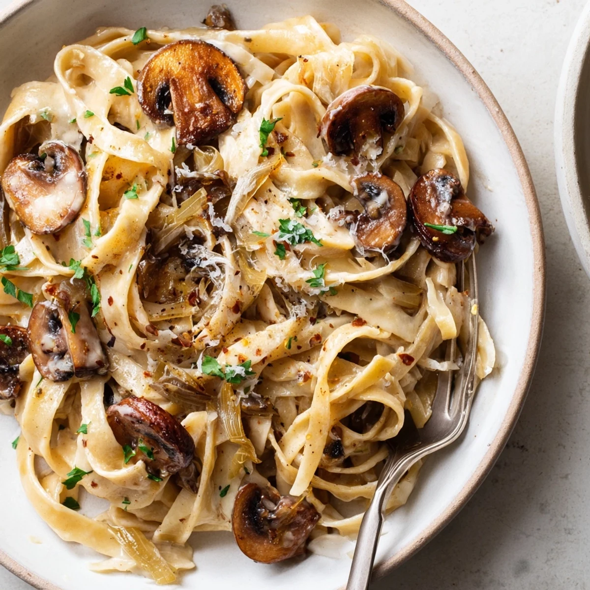 Steaming Caramelized Leek Mushroom Gruyere Pasta with golden leeks and earthy mushrooms