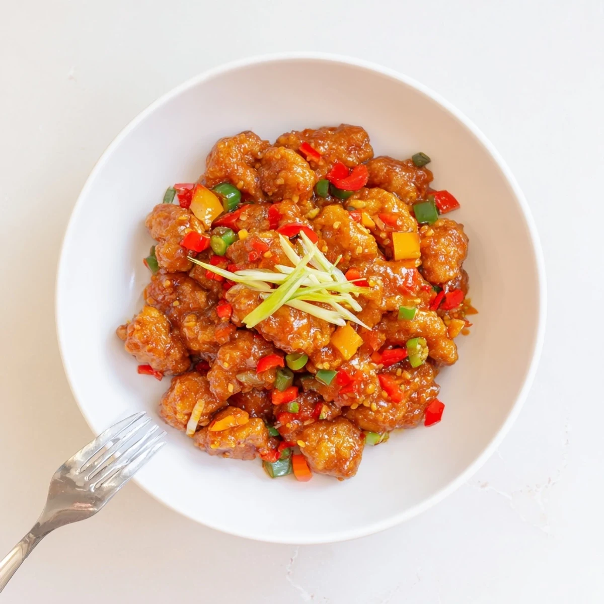 Crunchy fried Flavorful Chilli Chicken Indo Chinese tossed in tangy, fiery glaze