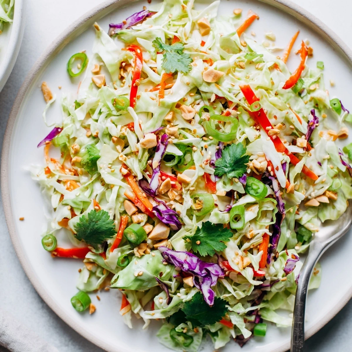 Asian Cabbage Salad with crunchy shredded cabbage, bright peppers, and sesame dressing