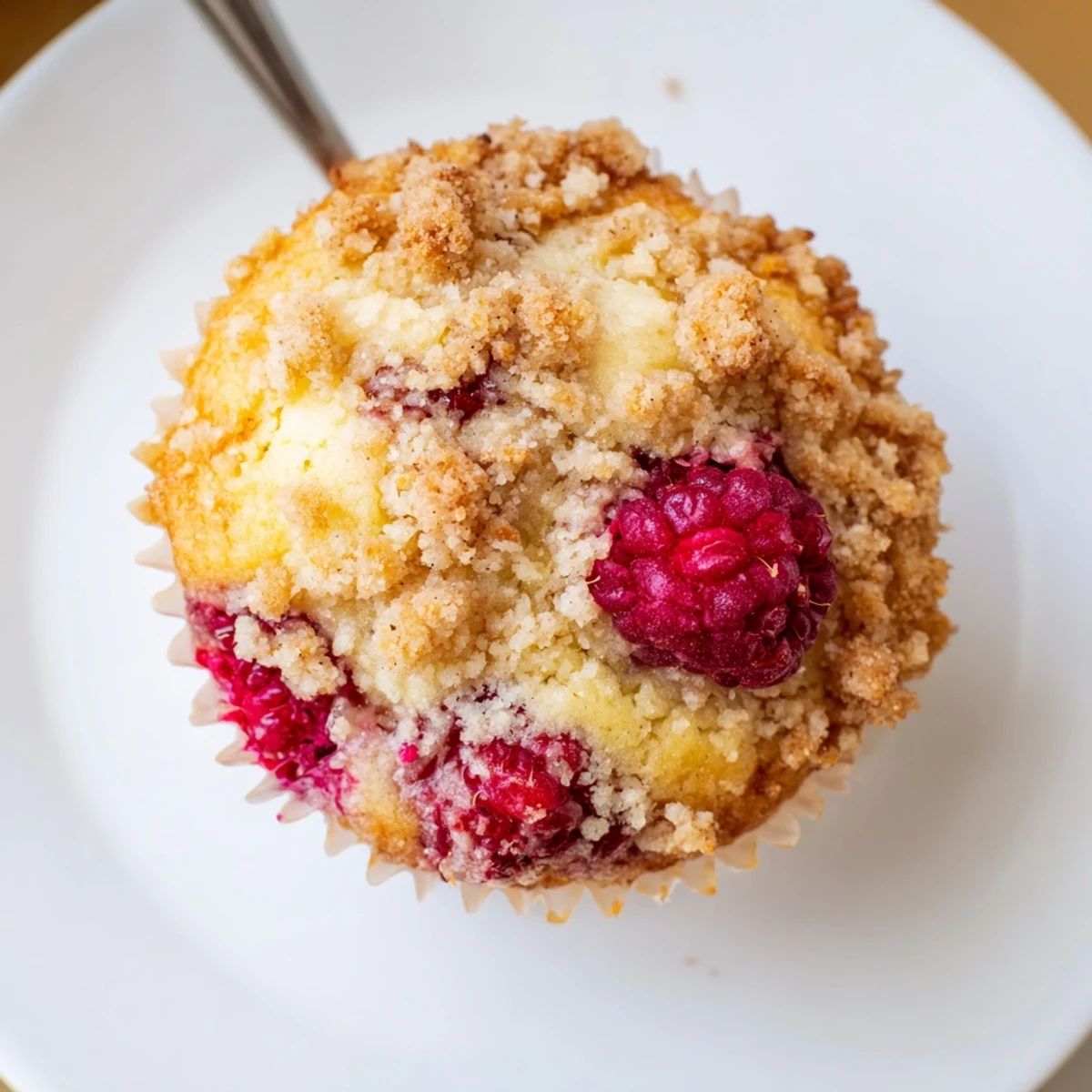 Warm Raspberry Streusel Muffins served with coffee, tender crumb and crisp top