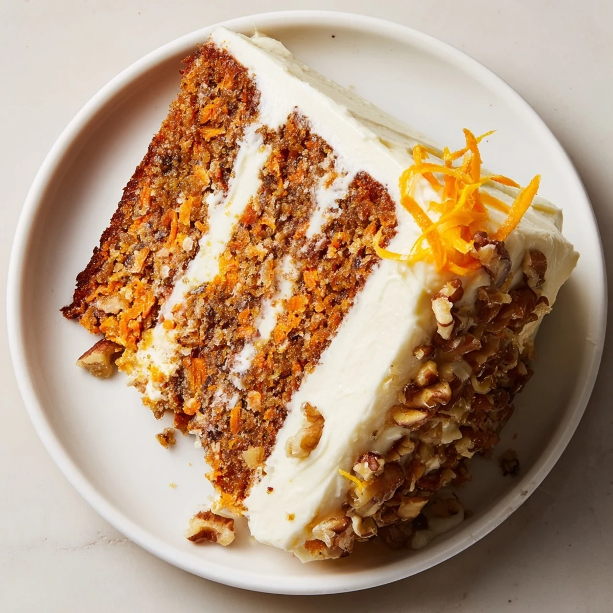 Single-layer Carrot Cake With Cream Cheese Frosting on rustic plate, fork-ready.