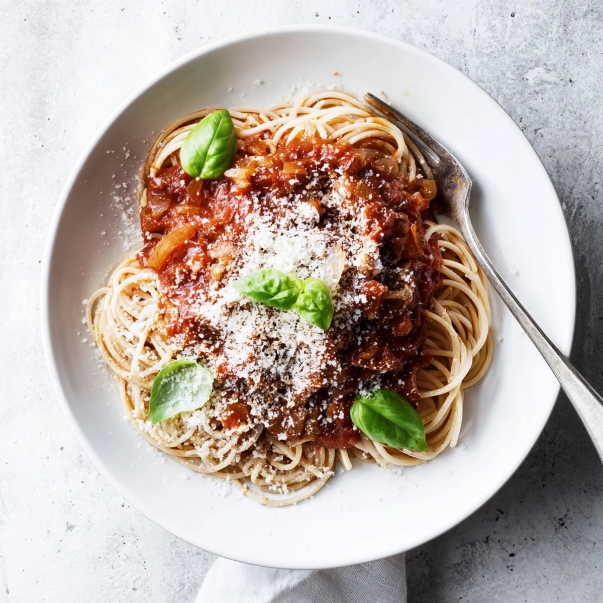 Classic Italian pasta recipe featuring tender noodles coated in rich homemade tomato sauce with fresh basil garnish