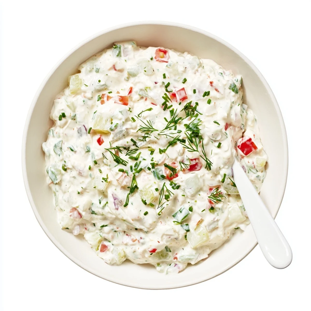 Thick white Grillos pickle de gallo ranch dip garnished with fresh dill and chives in rustic serving dish