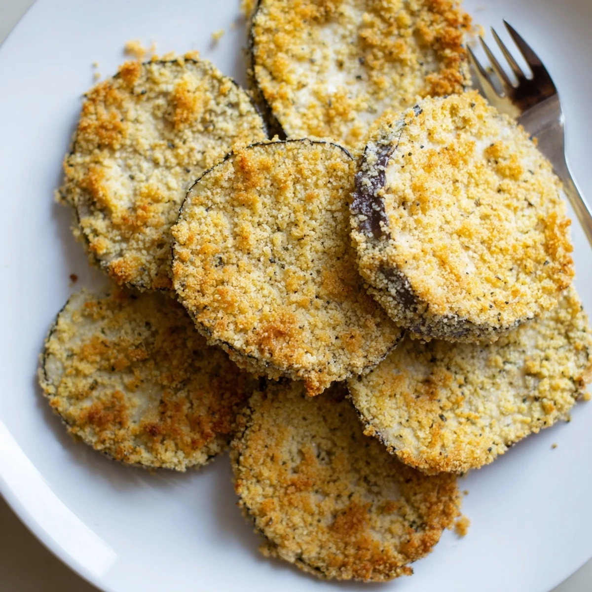 Crispy Baked Eggplant slices golden and crunchy, served with warm marinara