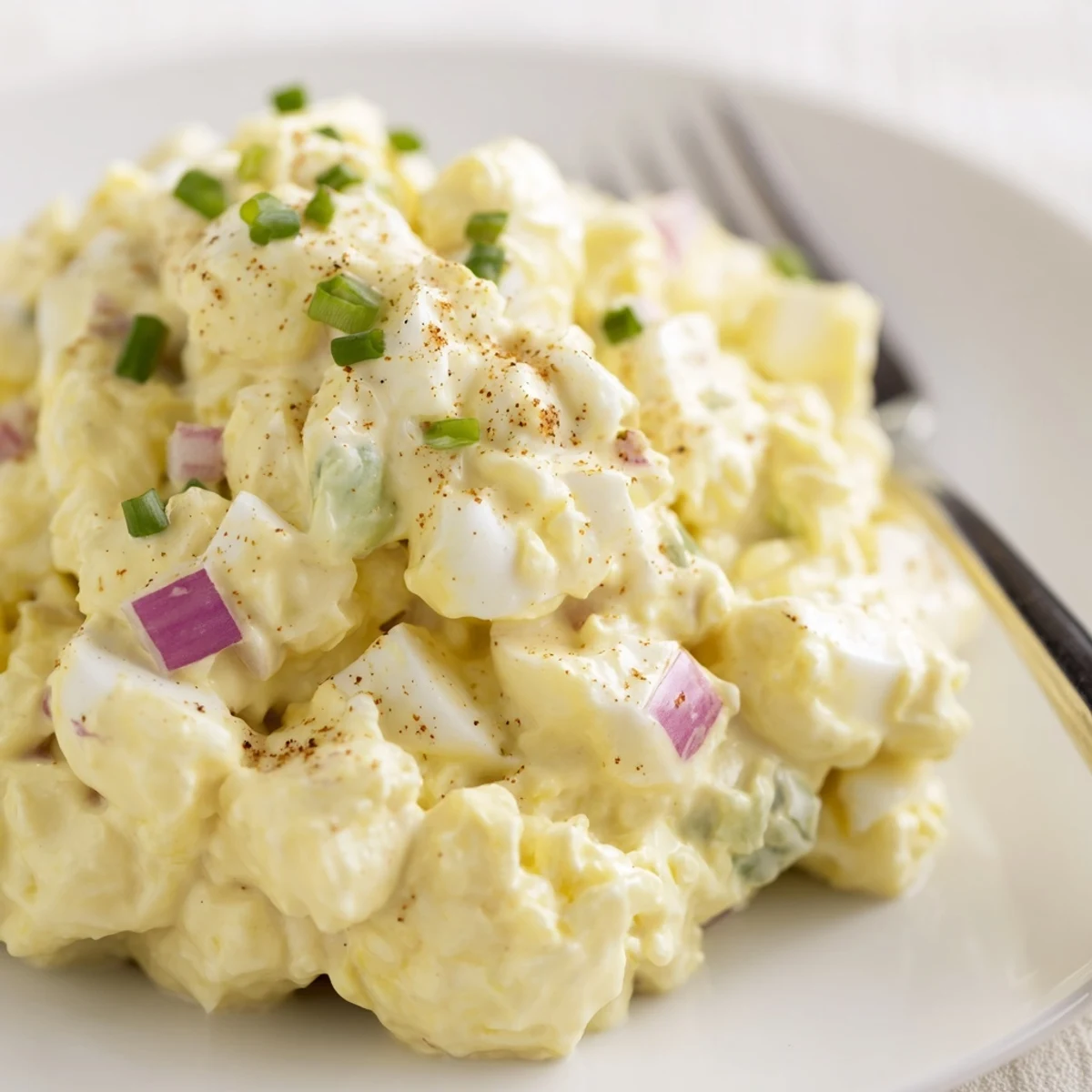 Easy Classic Egg Salad Recipe piled in lettuce cups, bright lemon tang