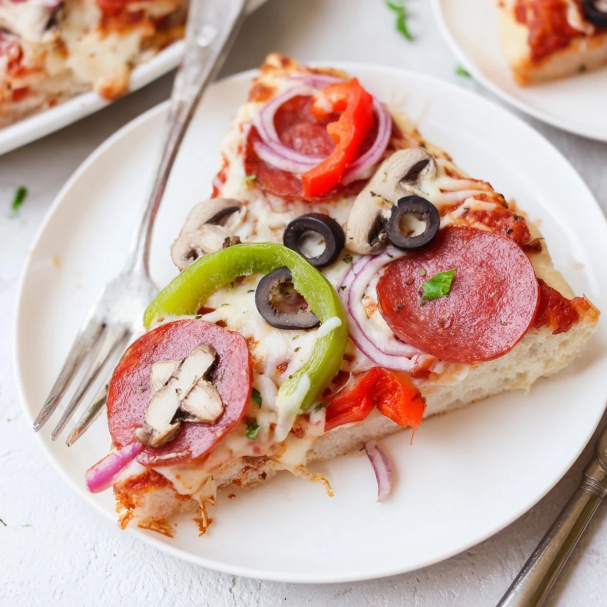 Focaccia Pizza Supreme topped with bubbling mozzarella, roasted peppers, and basil