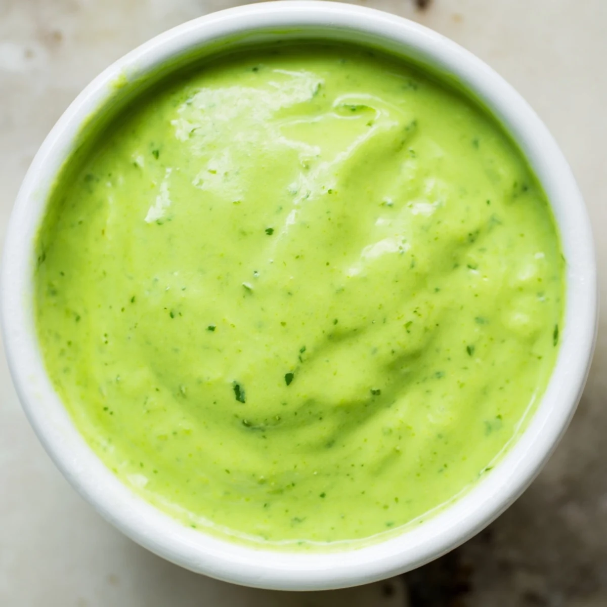 Smooth creamy cilantro lime sauce drizzled over grilled chicken tacos with fresh cilantro garnish