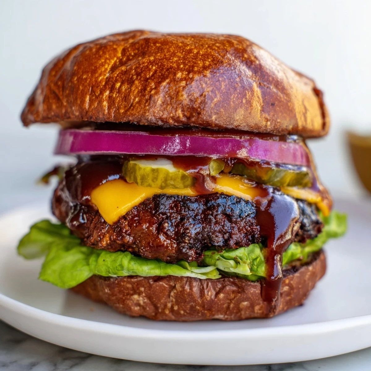 Grilled coffee rub burgers garnished with crisp lettuce, tomato, and pickles
