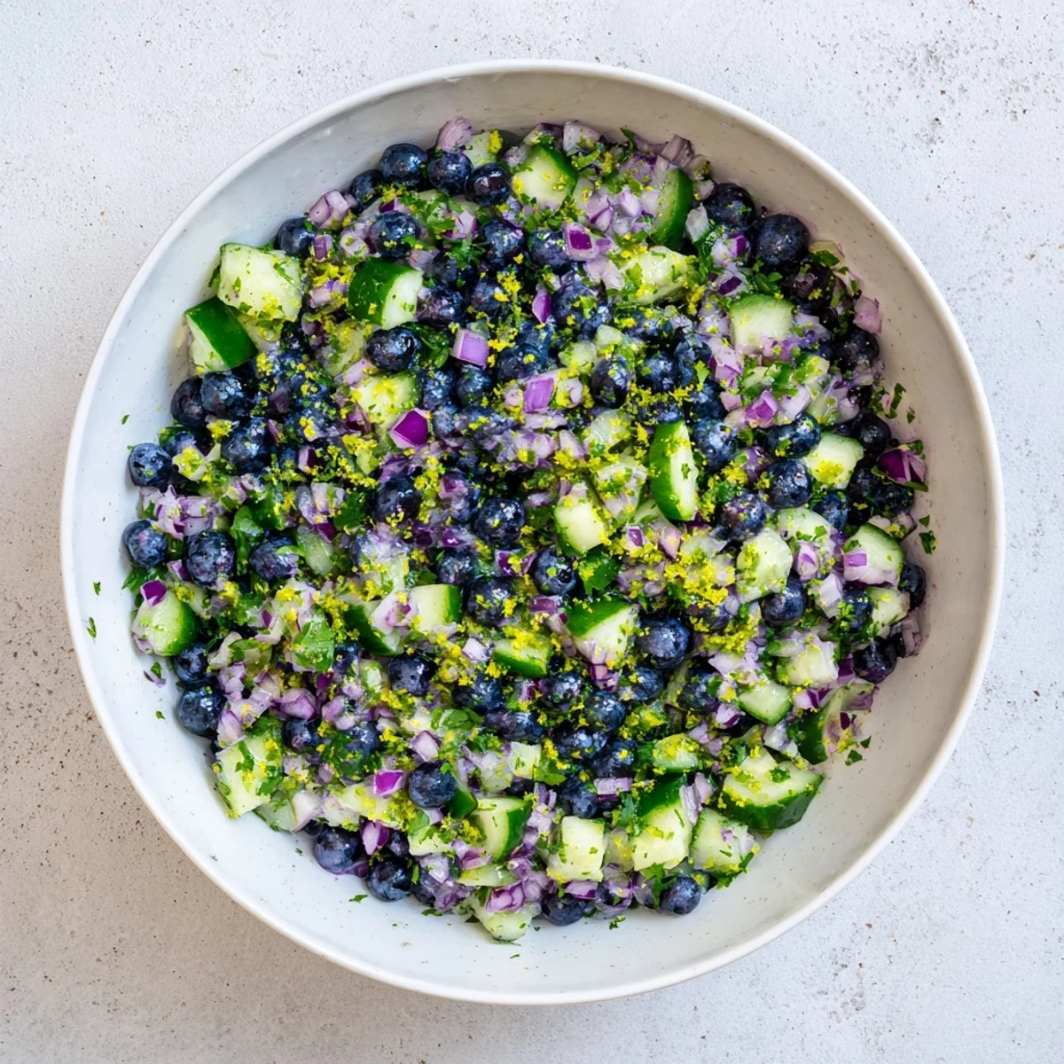 Fresh blueberry cucumber salsa served with tortilla chips for a refreshing summer appetizer