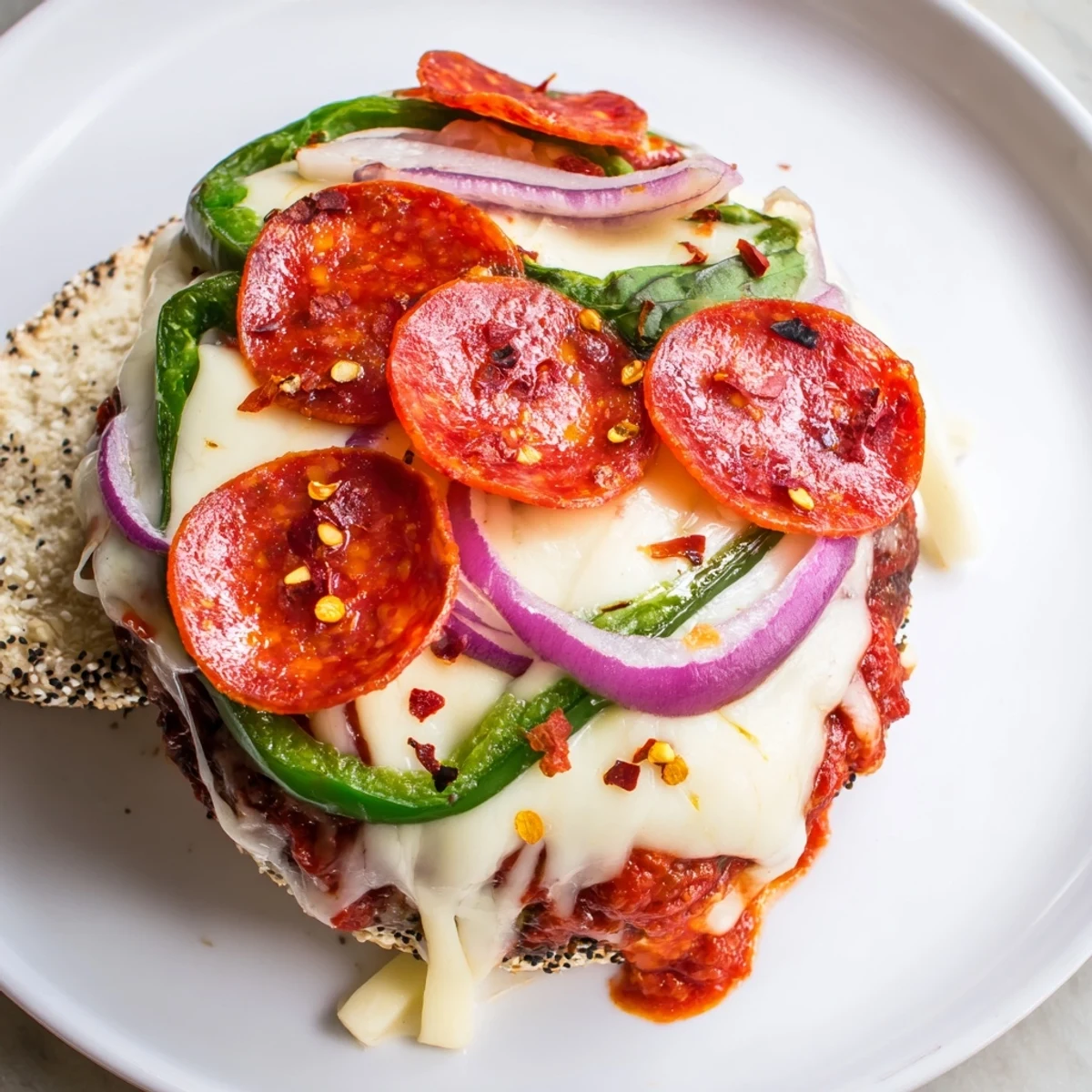 Juicy pizza burgers topped with bubbling cheese and vibrant bell peppers