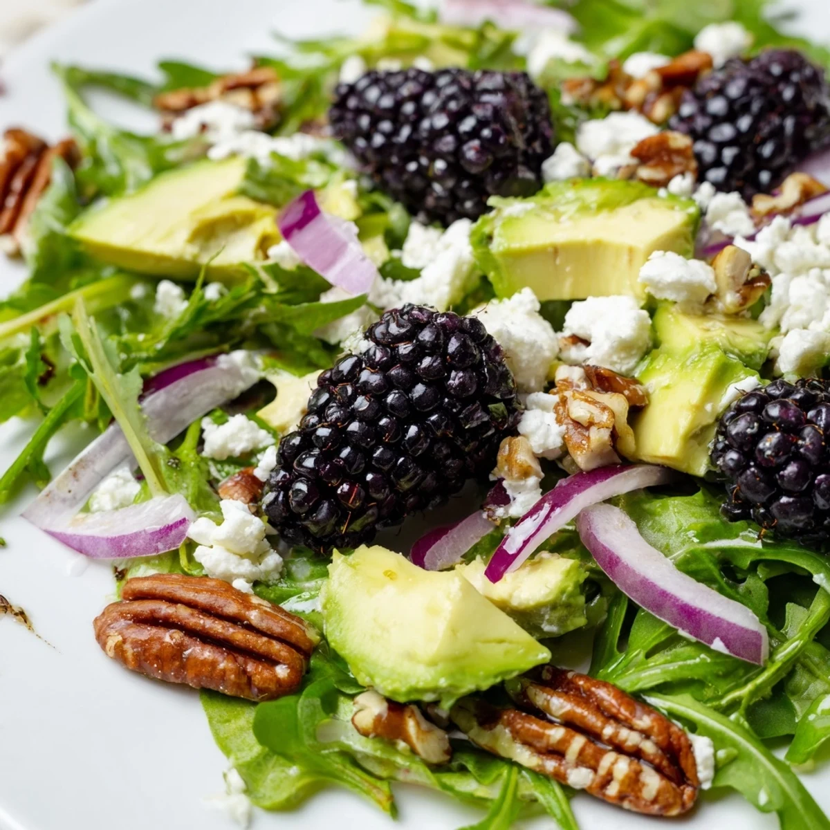 Fresh blackberry avocado salad with creamy avocado, feta, and zesty honey-lime dressing.