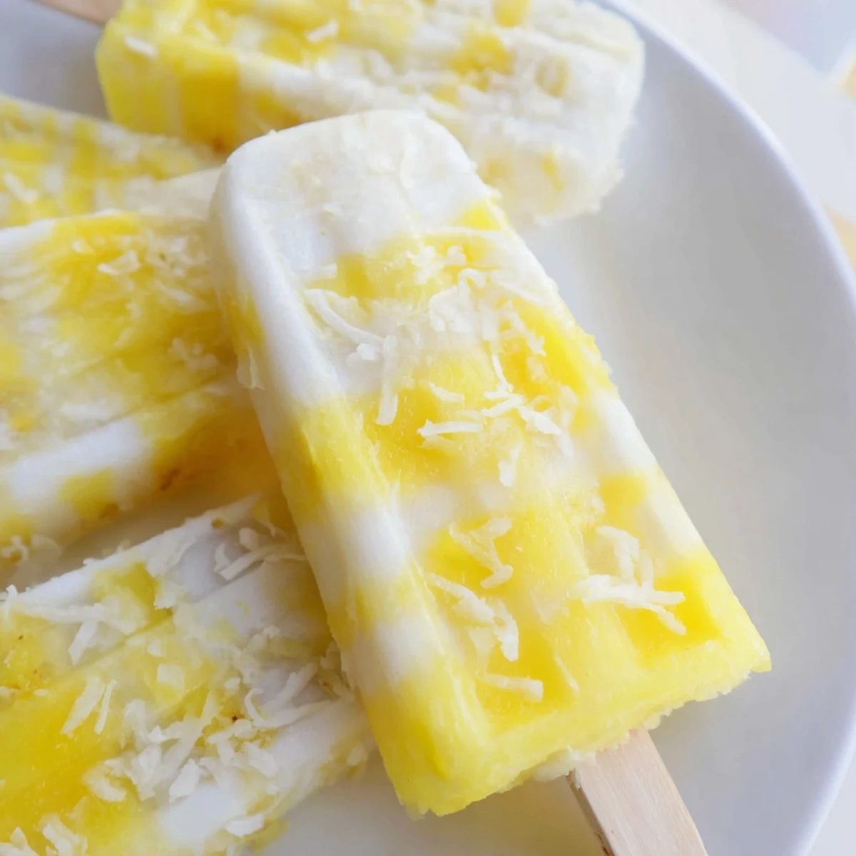 Refreshing vegan popsicles with coconut milk and fresh pineapple ready for summer cooling